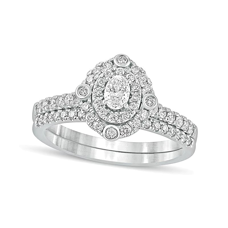 0.63 CT. TW Oval Diamond Double Frame Bridal Set in 10K White Gold