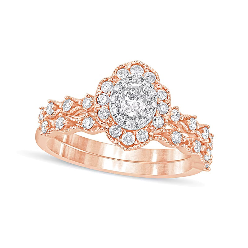 0.63 CT. TW Oval Diamond Frame Vintage-Style Bridal Set in 10K Rose Gold