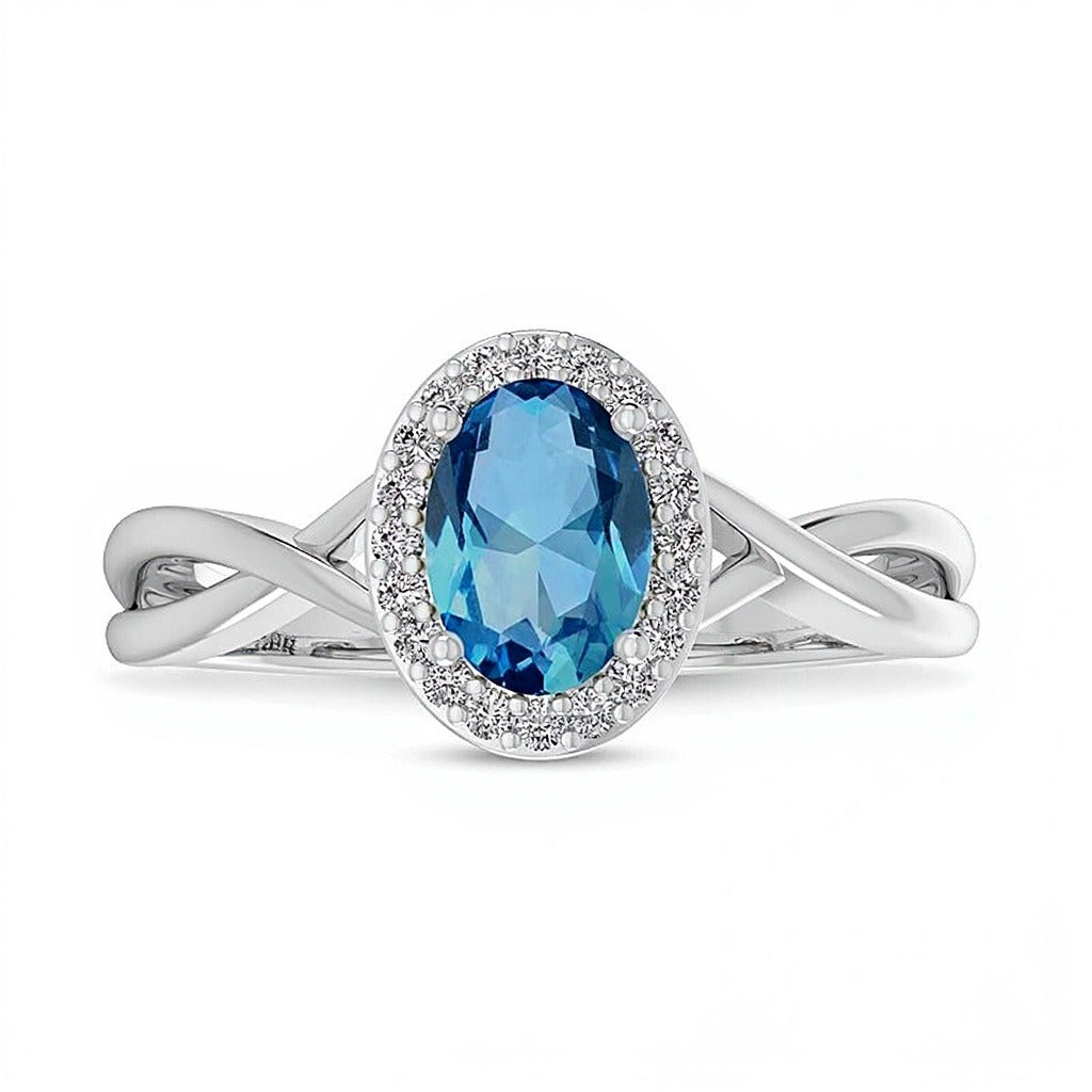 Oval Swiss Blue Topaz and 0.07 CT. TW Diamond Frame Crossover Shank Ring in 10K White Gold