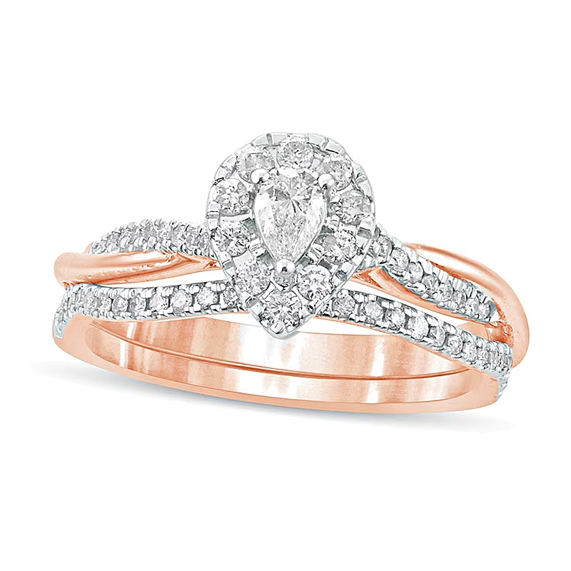 0.5 CT. TW Pear-Shaped Diamond Frame Twist Shank Bridal Set in 10K Rose Gold