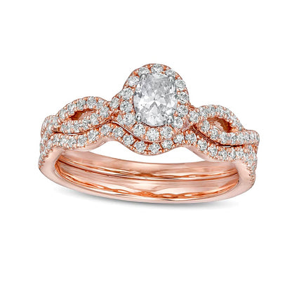 1.0 CT. TW Oval Diamond Frame Split Shank Bridal Set in 14K Rose Gold (I/I2)