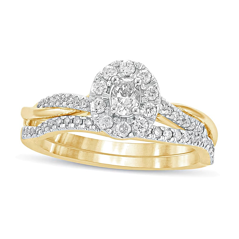 0.5 CT. TW Oval Diamond Frame Twist Shank Bridal Set in 10K Gold