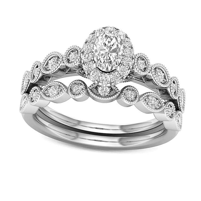 0.5 CT. TW Oval Diamond Frame Bridal Set in 14K Gold