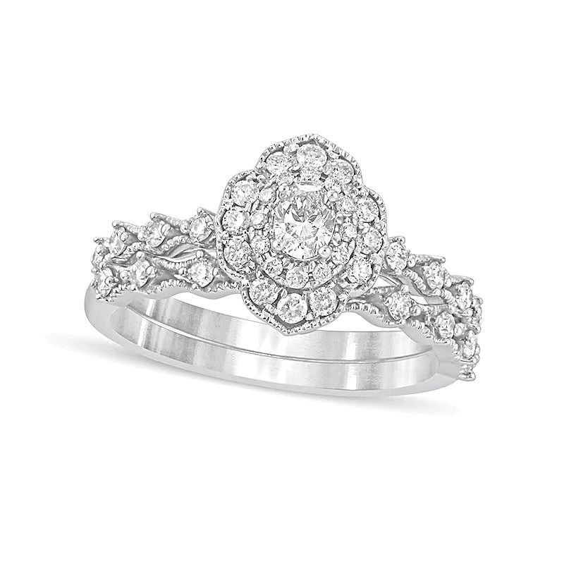 0.63 CT. TW Oval Diamond Frame Vintage-Style Bridal Set in 10K White Gold