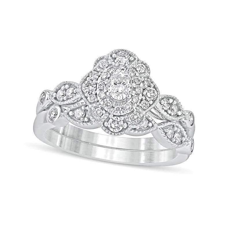 0.63 CT. TW Oval Diamond Double Petal Frame Vintage-Style Bridal Set in 10K White Gold