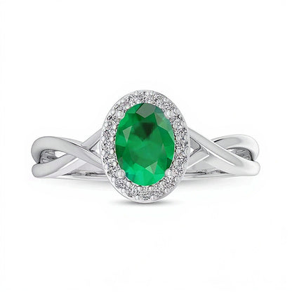 Oval Emerald and 0.07 CT. TW Diamond Frame Crossover Shank Ring in 10K White Gold