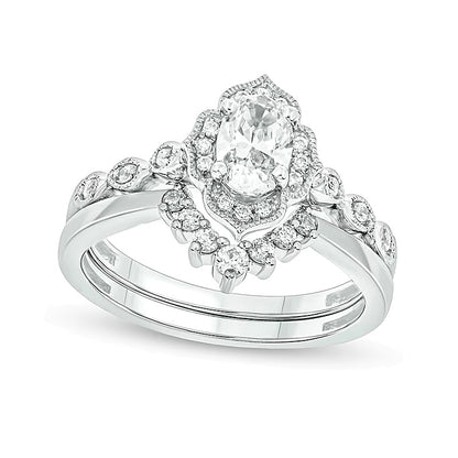 0.75 CT. TW Oval Diamond Frame Vintage-Style Bridal Set in 14K White Gold (I/I2)