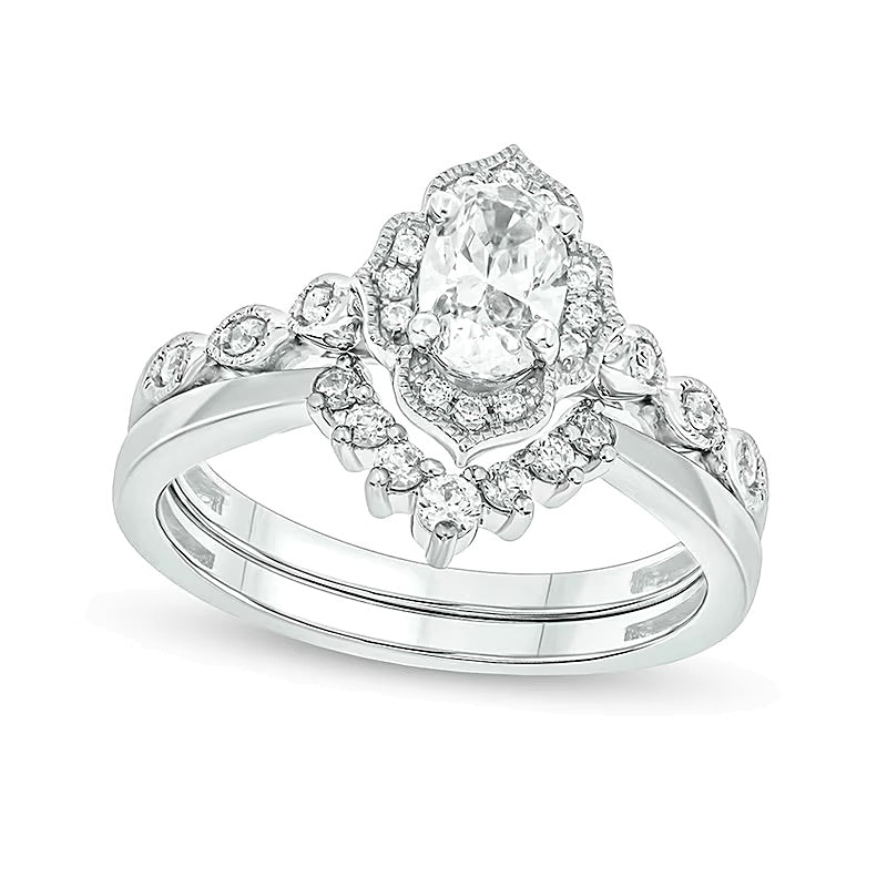0.75 CT. TW Oval Diamond Frame Vintage-Style Bridal Set in 14K White Gold (I/I2)