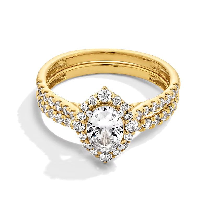 1.5 CT. TW Oval Diamond Frame Bridal Set in 14K Gold