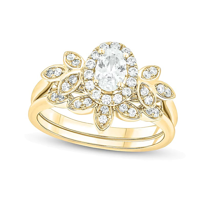 0.75 CT. TW Oval Diamond Frame Tri-Sides Leaf Bridal Set in 14K Gold (I/I2)