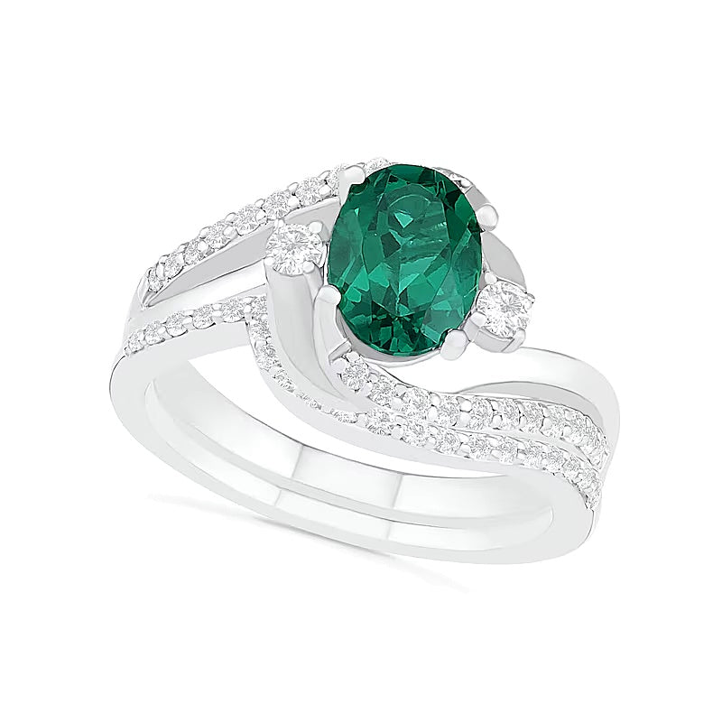 Oval Lab-Created Emerald and White Sapphire Side Accent Double Bypass Split Shank Bridal Set in Sterling Silver