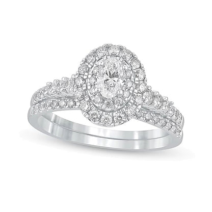 1.0 CT. TW Oval Diamond Frame Bridal Set in 10K White Gold