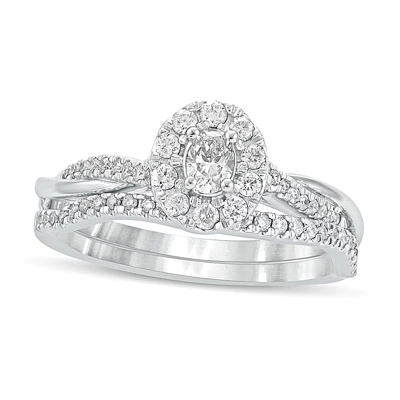 0.5 CT. TW Oval Diamond Frame Twist Shank Bridal Set in 10K White Gold