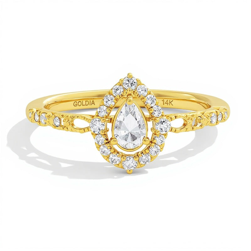 0.5 CT. TW Pear-Shaped Diamond Frame Engagement Ring in 14K Yellow Gold (I/I1)