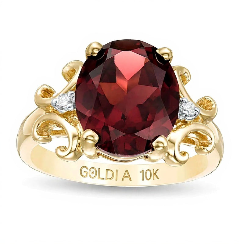 Oval Garnet and 0.05 CT. TW Diamond Scroll Frame Ring in 10K Gold