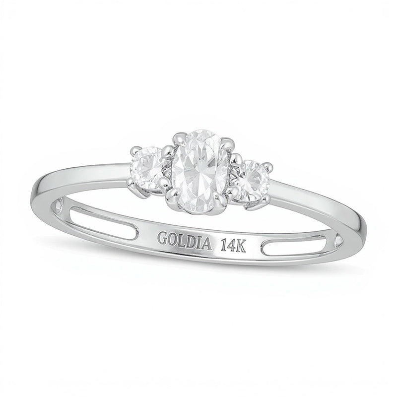 0.5 CT. TW Oval and Round Diamond Three Stone Engagement Ring in 14K White Gold
