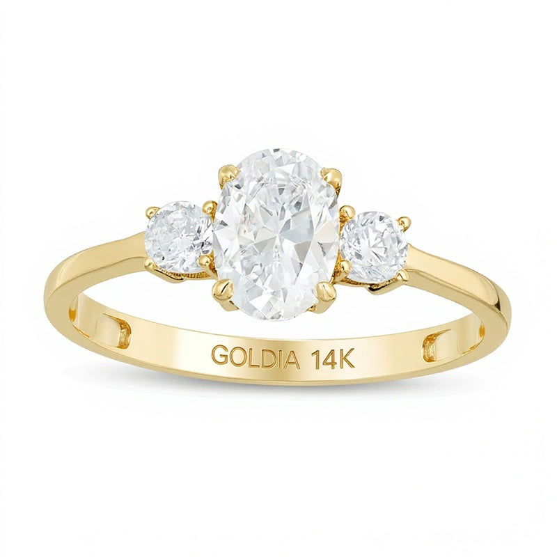 1.0 CT. TW Oval and Round Diamond Three Stone Engagement Ring in 14K Gold
