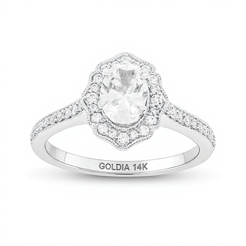 0.75 CT. TW Oval Diamond Flower Frame Vintage-Style Engagement Ring in 14K White Gold (I/I2)