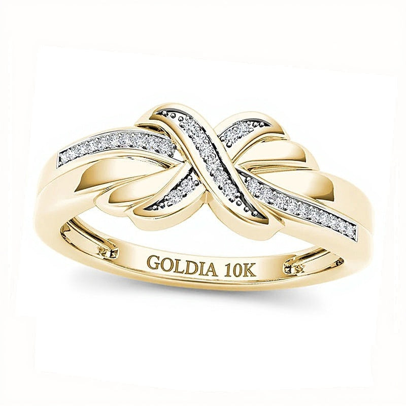 0.07 CT. TW Diamond "X" Ring in 10K Gold