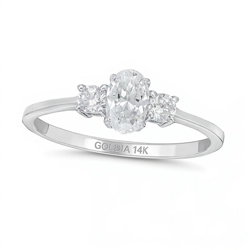 0.63 CT. TW Oval and Round Diamond Three Stone Engagement Ring in 14K White Gold