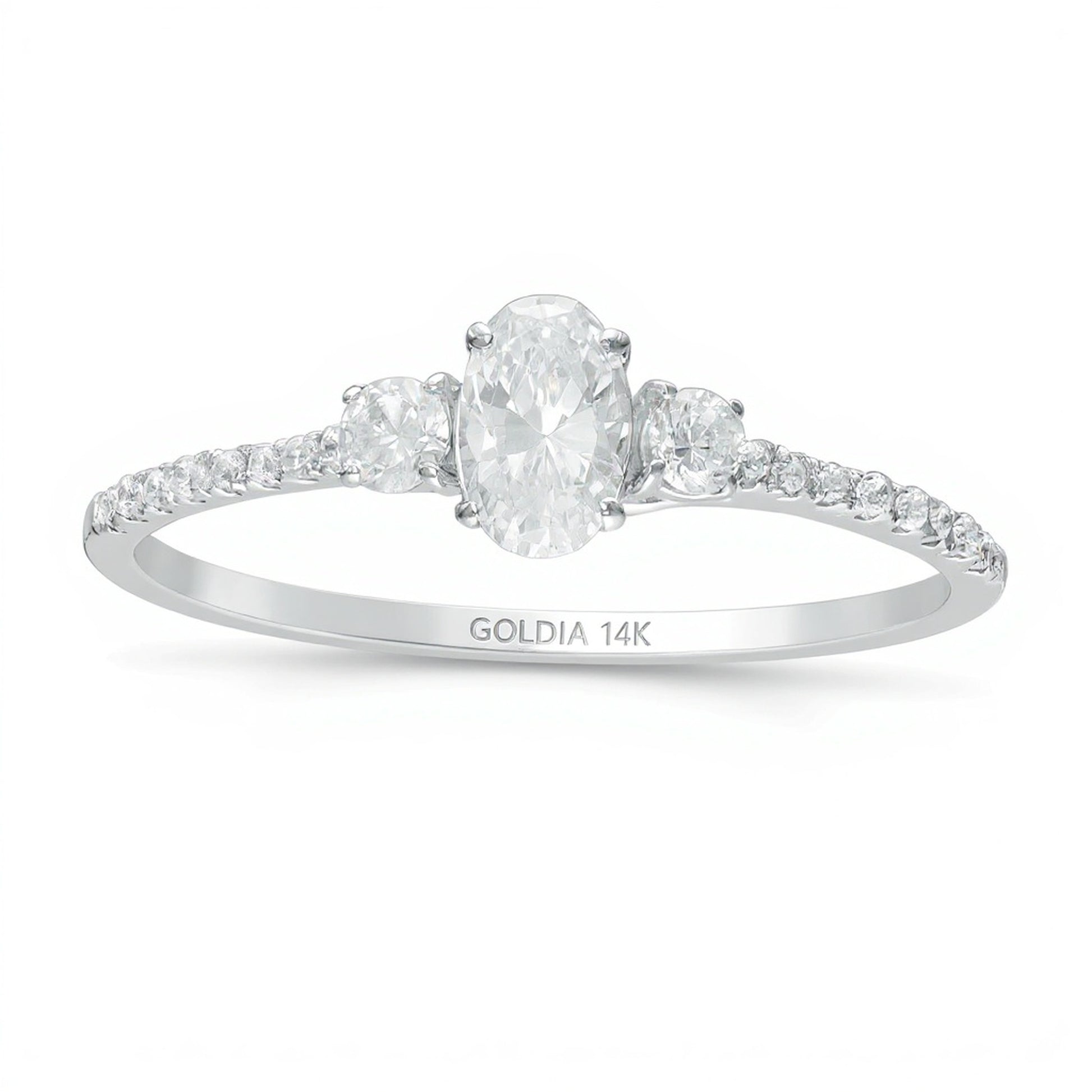 0.63 CT. TW Oval and Round Diamond Three Stone Engagement Ring in 14K White Gold