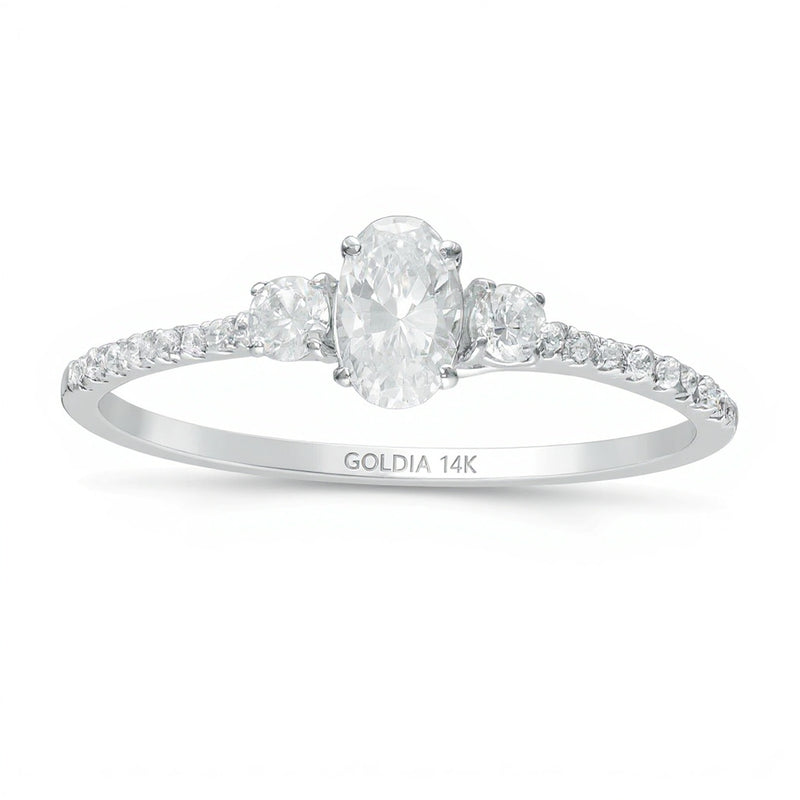 0.63 CT. TW Oval and Round Diamond Three Stone Engagement Ring in 14K White Gold