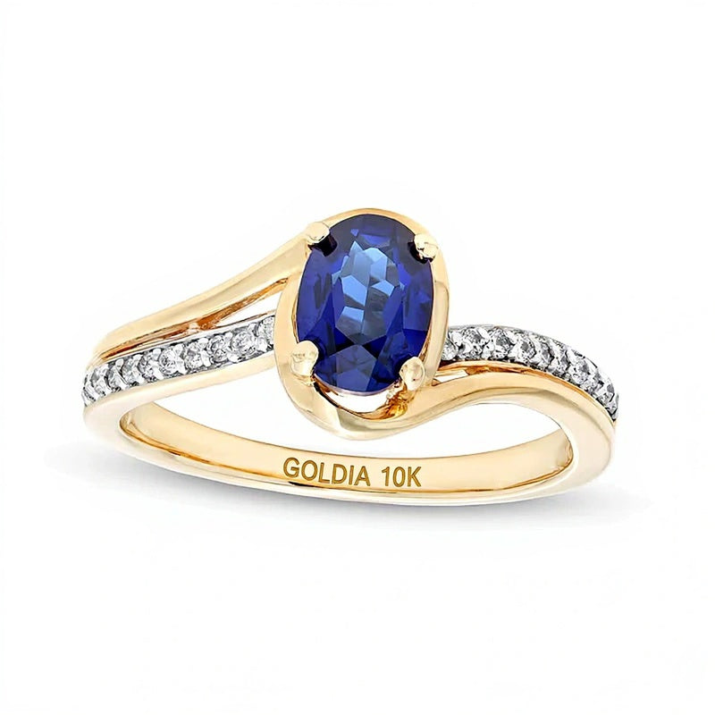 Oval Blue Lab-Created Sapphire and 0.1 CT. TW Diamond Bypass Ring in 10K Gold