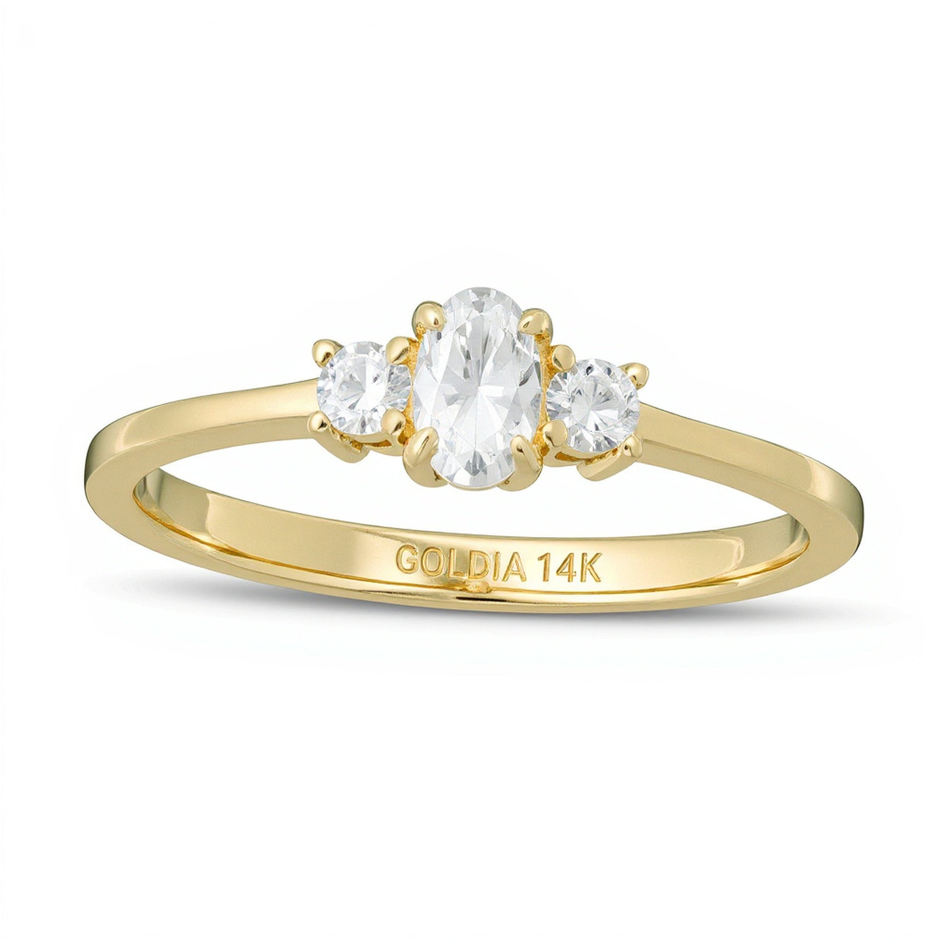 0.5 CT. TW Oval and Round Diamond Three Stone Engagement Ring in 14K Gold
