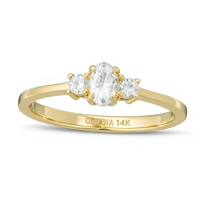 0.5 CT. TW Oval and Round Diamond Three Stone Engagement Ring in 14K Gold