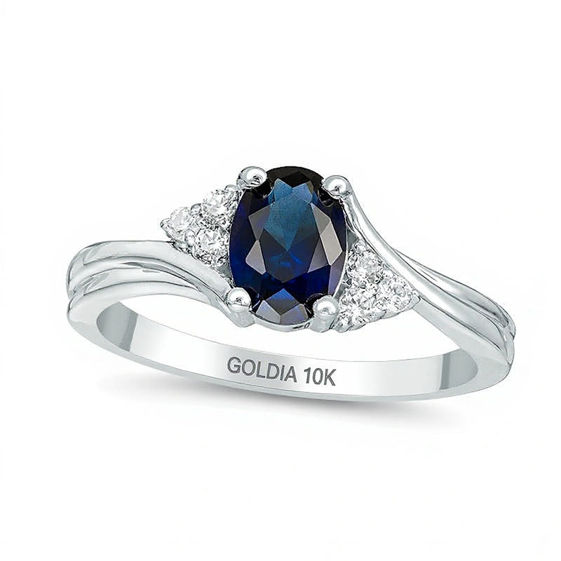 Oval Lab-Created Blue Sapphire and 0.1 CT. TW Diamond Tri-Sides Promise Ring in 10K White Gold