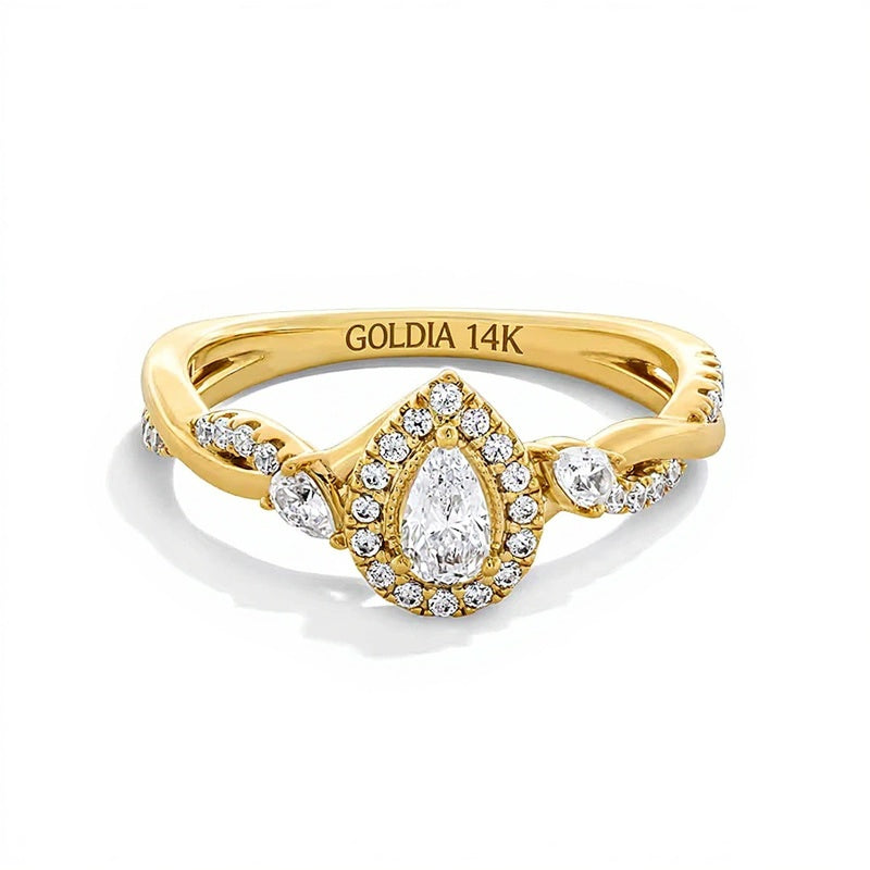 0.5 CT. TW Pear-Shaped Diamond Frame Twist Shank Engagement Ring in 14K Gold
