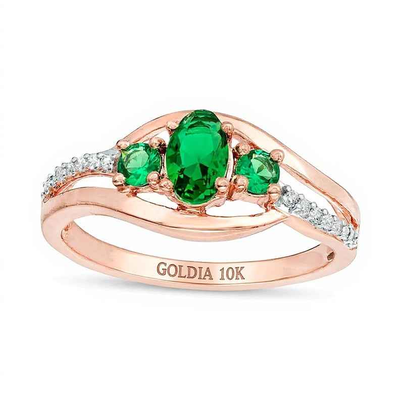 Oval Lab-Created Emerald and 0.05 CT. TW Diamond Three Stone Bypass Engagement Ring in 10K Rose Gold