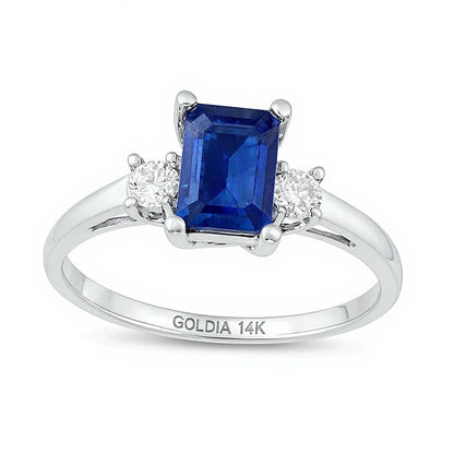 Emerald-Cut Blue Sapphire and 0.2 CT. TW Diamond Three Stone Ring in 14K White Gold