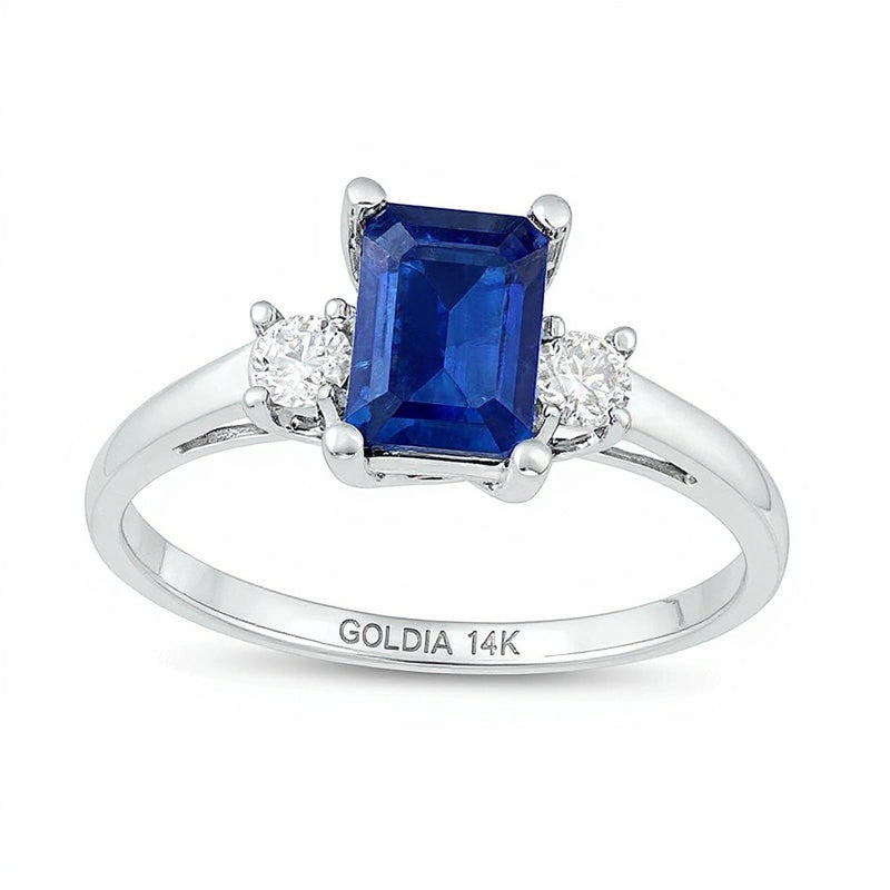 Emerald-Cut Blue Sapphire and 0.2 CT. TW Diamond Three Stone Ring in 14K White Gold