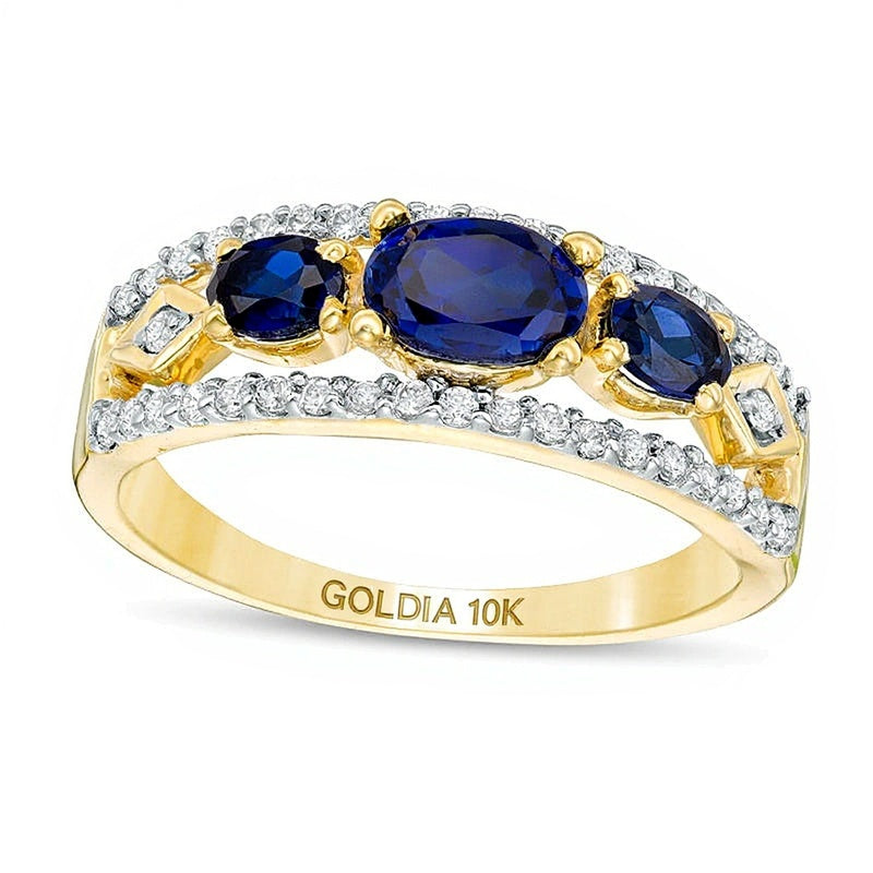 Sideways Oval Lab-Created Blue Sapphire and 0.25 CT. TW Diamond Three Stone Ring in 10K Gold