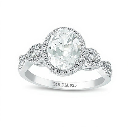Oval Lab-Created White Sapphire and 0.17 CT. TW Diamond Frame Infinity Shank Engagement Ring in Sterling Silver