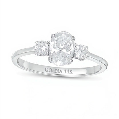 1.0 CT. TW Oval and Round Diamond Three Stone Engagement Ring in 14K White Gold