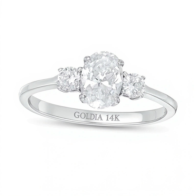 1.0 CT. TW Oval and Round Diamond Three Stone Engagement Ring in 14K White Gold