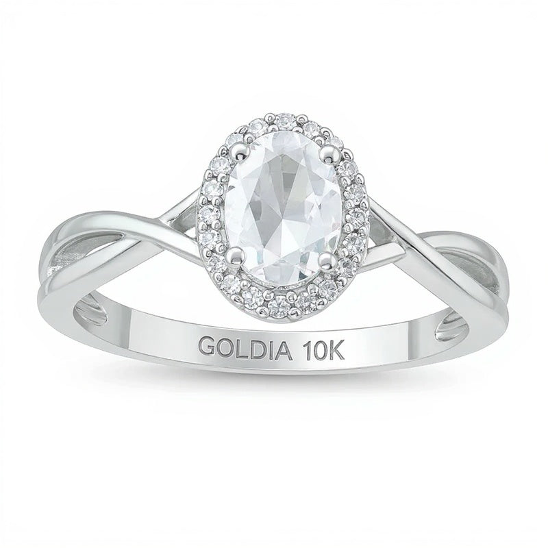 Oval Aquamarine and 0.07 CT. TW Diamond Frame Twist Shank Ring in 10K White Gold