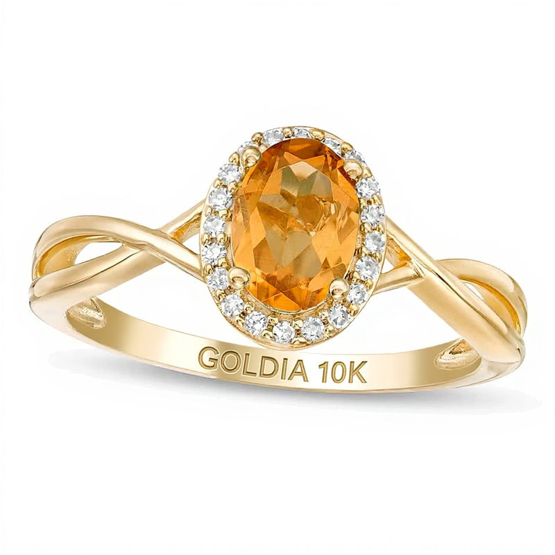 Oval Citrine and 0.07 CT. TW Diamond Frame Twist Shank Ring in 10K Gold