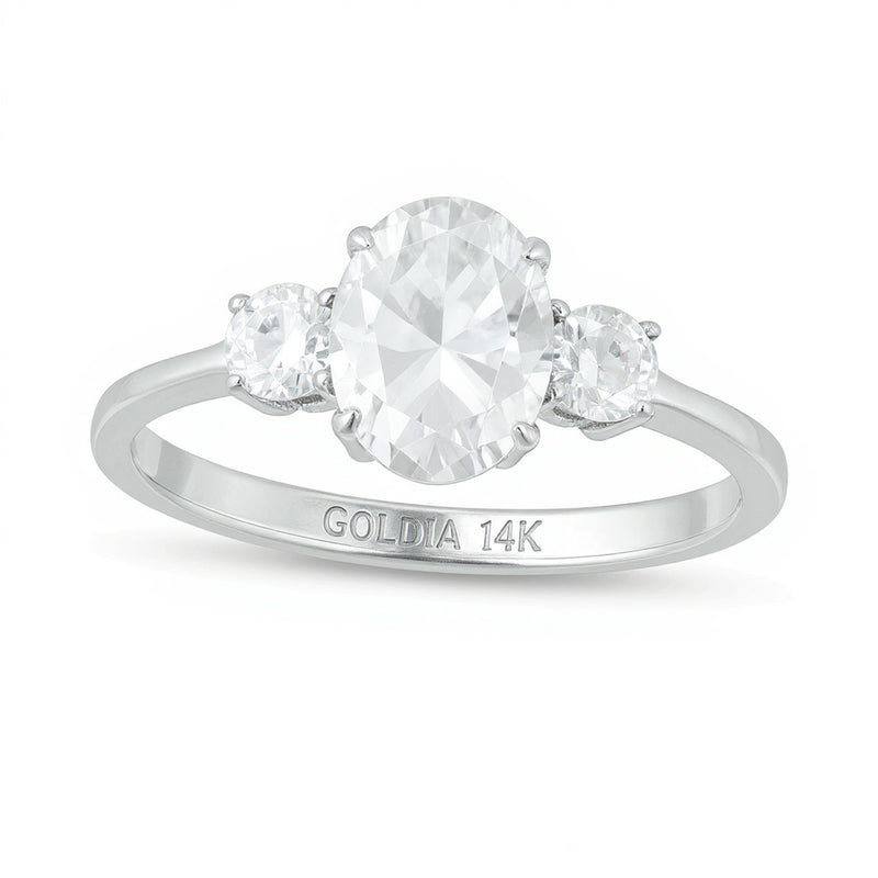 1.25 CT. TW Oval and Round Diamond Three Stone Engagement Ring in 14K White Gold
