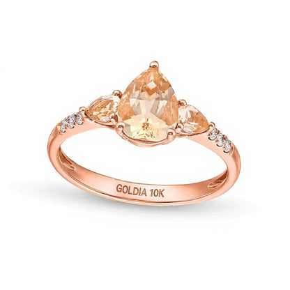 Pear-Shaped Morganite and 0.07 CT. TW Diamond Three Stone Ring in 10K Rose Gold
