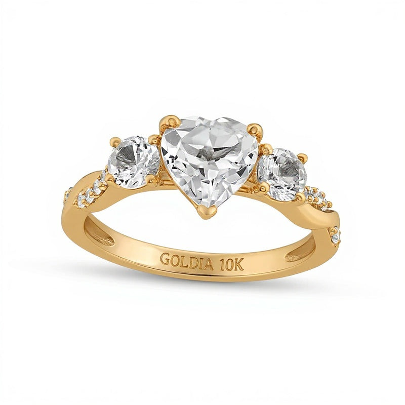 Heart-Shaped White Lab-Created Sapphire and 0.1 CT. TW Diamond Three Stone Twist Shank Engagement Ring in 10K Gold