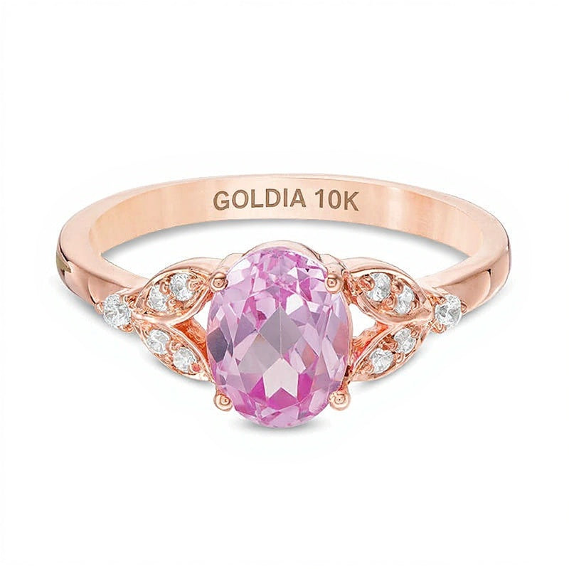 Oval Lab-Created Pink Sapphire and 0.1 CT. TW Diamond Leaf Sides Ring in 10K Rose Gold