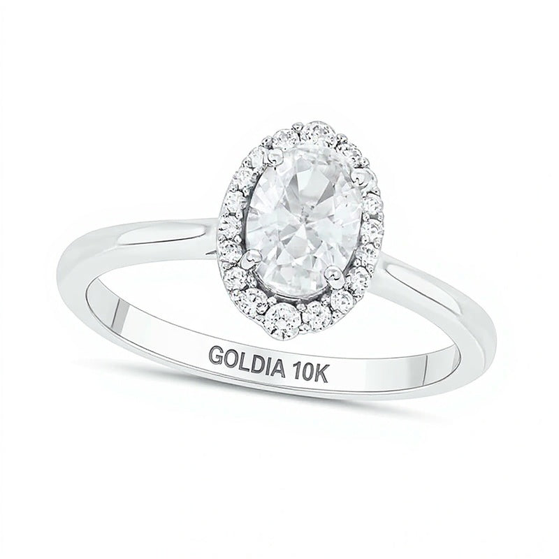 Oval White Lab-Created Sapphire and 0.17 CT. TW Diamond Frame Engagement Ring in 10K White Gold