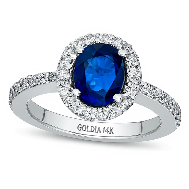 Oval Blue Sapphire and 0.5 CT. TW Diamond Frame Engagement Ring in 14K White Gold