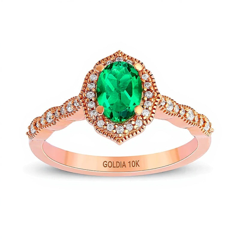 Oval Emerald and 0.17 CT. TW Diamond Quatrefoil Frame Vintage-Style Ring in 10K Rose Gold