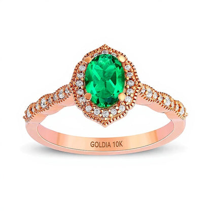 Oval Emerald and 0.17 CT. TW Diamond Quatrefoil Frame Vintage-Style Ring in 10K Rose Gold