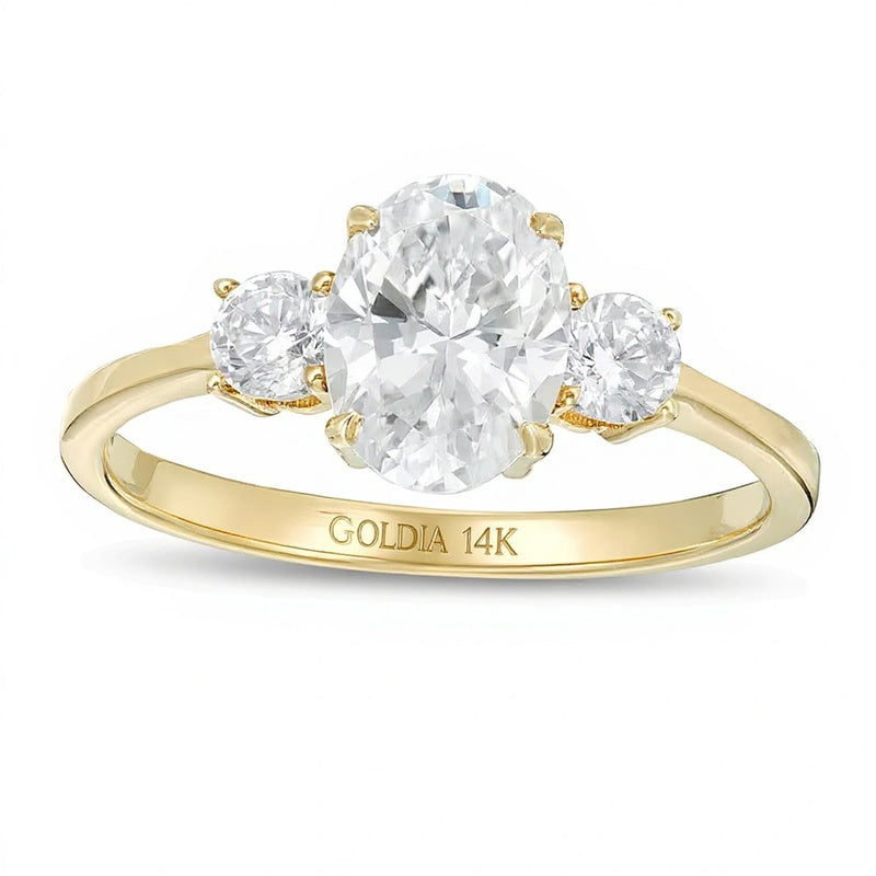 1.25 CT. TW Oval and Round Diamond Three Stone Engagement Ring in 14K Gold