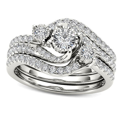 0.75 CT. TW Diamond Three Stone Bypass Three Piece Bridal Set in 14K White Gold